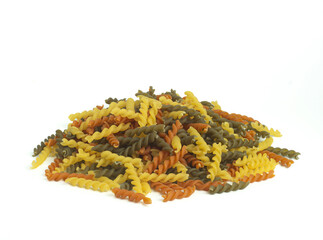 An image flat lay isolated heap or pile pasta spiral is a food raw dry for ingredient cook food a homemade white background.