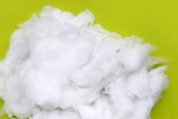 Polyester stable fiber on green background.