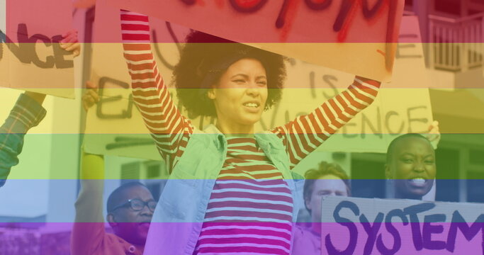 Image of rainbow over diverse protesters with banners - Powered by Adobe