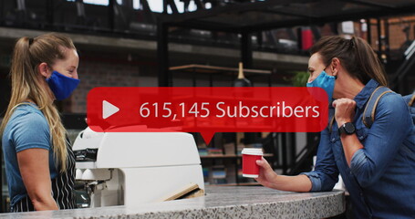 Image of media icon over two caucasian female friends with face masks talking