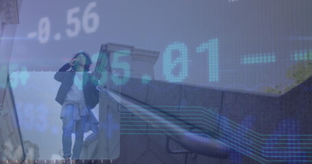 Image of data processing over biracial businessman talking on smartphone