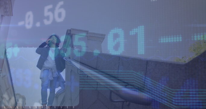 Image of data processing over biracial businessman talking on smartphone