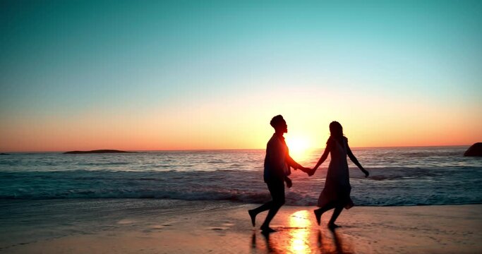 Couple, ocean and waves with running at sunset for vacation, holiday and date together in Los Angeles. Man, woman and holding hands at beach for fun, romance and adventure in summer with freedom