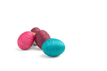 Easter eggs made of thread, isolated on white background.
