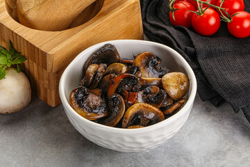 Roasted champignon mushrooms in the bowl