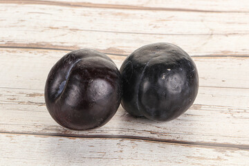 Two ripe sweet black plums