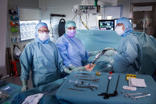 Surgeons doing laparoscopic surgery of patient in operation theater at hospital