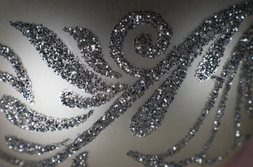 Silver background with sparkles and floral motif
