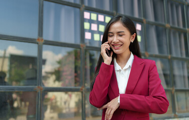 Accountant, Asian independent business woman Positive concept using smartphone to relax with mobile app and use chat business communication Contact online marketing that is extremely profitable.