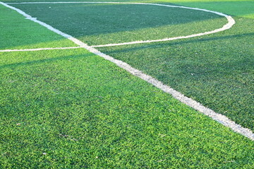 artificial green grass soccer field with white line