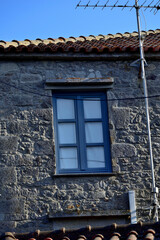 blue window at a house - the stone village Kontias, Lemnos island, Greece, Aegean sea