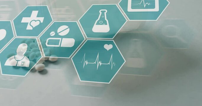 Animation of medical icons over spilled tablet and pill bottle