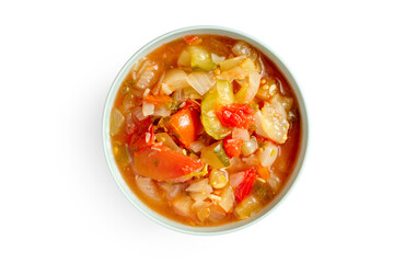 Bowl with stewed vegetable salad on white background. Top view. Vitamin salad made from natural vegetables.