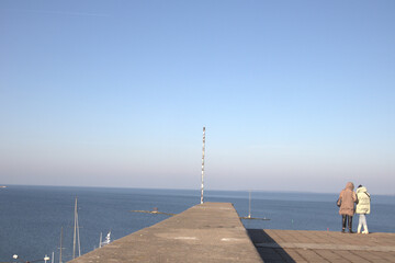 person walking on the pier