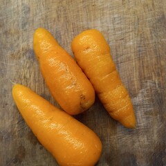 carrots on wooden background