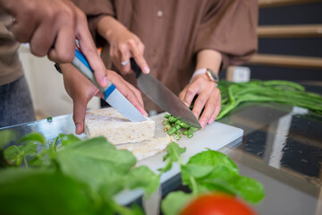 Portrait of a Muslim couple preparing food together