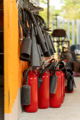 Several red fire extinguishers were lined up on the floor.