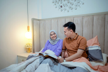 Portrait of couple reading book together