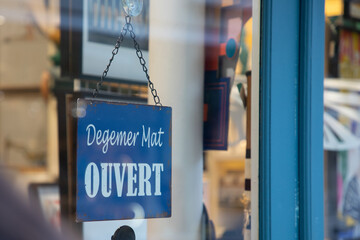 Degemer mat text means welcome in Breton and ouvert french text means open on shop door entrance