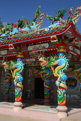 Fototapeta premium Chinese temple near Udon Thani city, Thailand. Religious traditional national architecture. Beautiful landmark, architectural monument