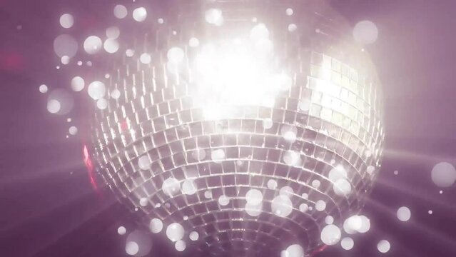 Animation of glowing light spots moving on seamless loop over disco mirror ball