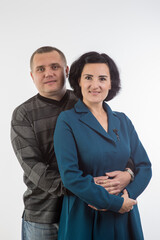 studio portrait of husband and wife happy family 4