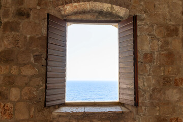 A window with a view of the sea. Dubrovnik old town. Selective focus