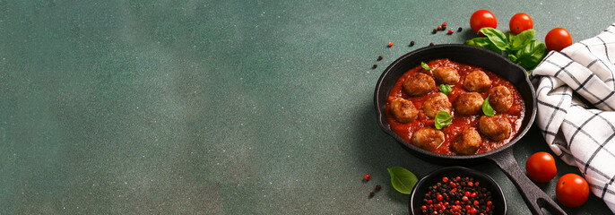 .Meatballs with tomato sauce and basil in a frying pan - 752044806