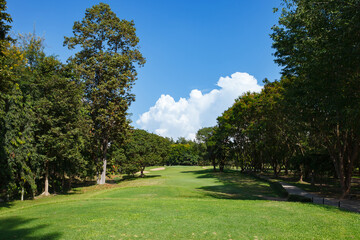 Golf course with blue sky background