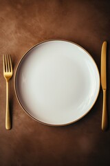 A plate with a fork and knife on a table. Suitable for restaurant and dining concepts