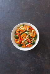 Udon noodles with shrimp, broccoli and peppers. Asian cuisine.