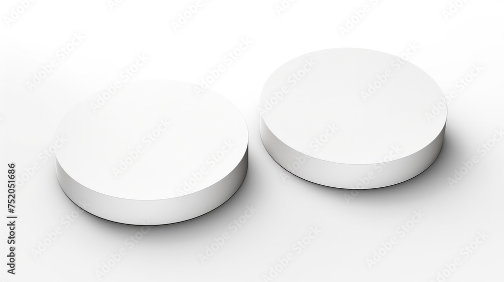Aufkleber A couple of white round objects on a table. Ideal for product displays