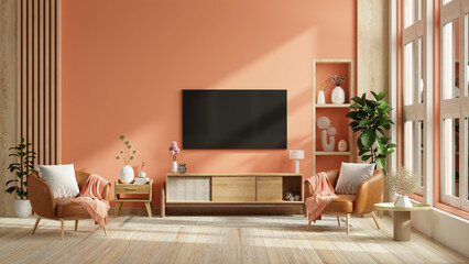 Mockup a TV wall mounted with leather armchair in pastel tone peach fuzz color wall - 752061824