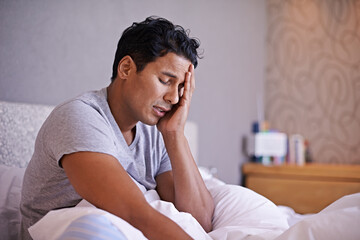 Man, sad and frustrated in bedroom with problem, disappointment and upset with mental health in...
