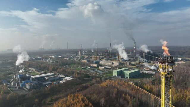 Aerial view of Coking Plant factory. Coke plant.Heavy industry in Europe, Poland, Dabrowa Gornicza. Air pollution from chimneys. Gas combustion in a coking plant.Ecology and environmental. 