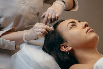 Obraz na płótnie Canvas Hair injection in a beauty salon