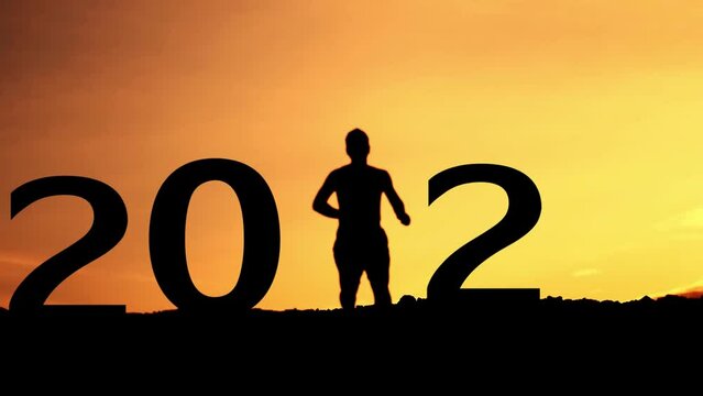 Silhouette of a happy and free person in 2024. Concept 2024 is a good year.