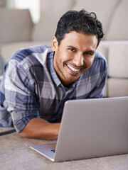 Man, freelancer and internet for laptop in portrait of living room, research and scroll or browse...