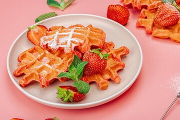 Homemade Belgian Waffles with strawberries. Gluten-free red dessert, fresh fruits and basil