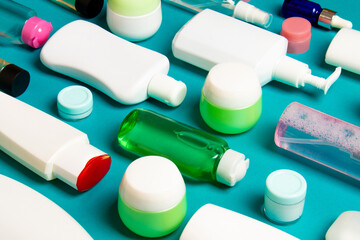 Group of plastic bodycare bottle Flat lay composition with cosmetic products on colored background empty space for you design. Set of White Cosmetic containers, top view with copy space
