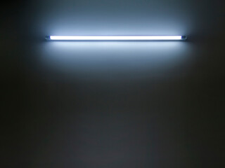 Technology light is glowing on the wall. Abstract lights lines on black background vector...