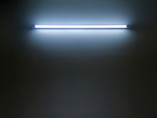 Technology light is glowing on the wall. Abstract lights lines on black background vector illustration. Easy replace use to any image, glowing lines, tunnel, neon lights, virtual reality.