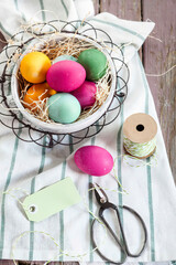 Colourful Easter basket with twine and tag