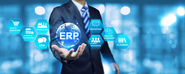 ERP Enterprise Resource Planning concept with businessman hold globe and planning to operational...