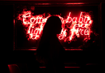 Sensual female body silhouette. Come baby light my fire. Neon lights , letters font style.