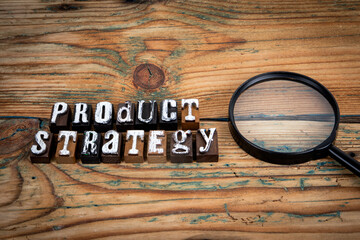 PRODUCT STRATEGY. Alphabet letters on wood texture background