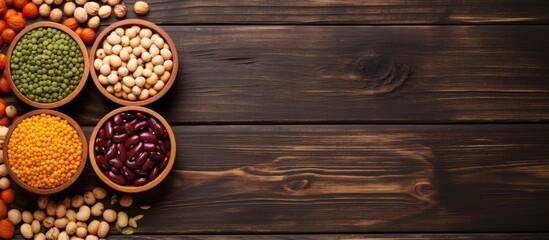 Hearty Selection of Legumes and Beans Arranged in Bowls on Wooden Surface