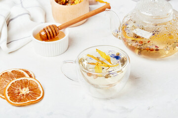 Alpine wellness elixir, natural tea in glass cup. Organic mountain blend - refreshing herbal infusion concept