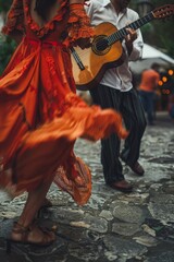A woman dressed in orange passionately plays a guitar, her fingers expertly strumming the strings. The vibrant color of her dress contrasts with the guitar, creating a visually striking scene
