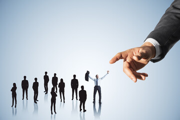Hand pointing at crowd of businessmen on light background. Worker management concept.